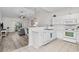 Well-lit open kitchen with white appliances and breakfast bar, flowing into the living area at 6253 Catalina Dr. # 632, North Myrtle Beach, SC 29582