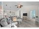 Bright living room featuring modern decor, vaulted ceiling with fan, and seamless flow to dining and hall at 6253 Catalina Dr. # 632, North Myrtle Beach, SC 29582