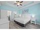 Stylish main bedroom with a tray ceiling, ocean-themed wall art, and ensuite bathroom access at 6253 Catalina Dr. # 632, North Myrtle Beach, SC 29582