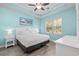 Serene bedroom featuring a ceiling fan and large window, creating a bright and airy atmosphere at 6253 Catalina Dr. # 632, North Myrtle Beach, SC 29582