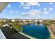 Beautiful view of a serene pond surrounded by charming homes and a bright blue sky at 6253 Catalina Dr. # 632, North Myrtle Beach, SC 29582