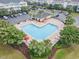 Aerial view of heart-shaped pool surrounded by trees and lounge chairs at 6253 Catalina Dr. # 632, North Myrtle Beach, SC 29582