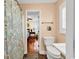 Bathroom view featuring a toilet, sink, and floral curtain-covered shower at 638 S Waccamaw Dr., Murrells Inlet, SC 29576