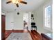 Bedroom with hardwood floors, light walls, and a door to the hallway at 638 S Waccamaw Dr., Murrells Inlet, SC 29576