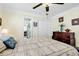 Bedroom featuring hardwood floors and a large bed with a patterned comforter at 638 S Waccamaw Dr., Murrells Inlet, SC 29576