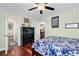 Well-lit bedroom with hardwood floors, ceiling fan, and view into bath and kitchen at 638 S Waccamaw Dr., Murrells Inlet, SC 29576