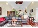 Cozy living room featuring hardwood floors, a plush leather sofa, and unique decor accents at 638 S Waccamaw Dr., Murrells Inlet, SC 29576