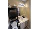 This bathroom features a toilet, storage rack, and sink at 6500 Colonial Dr. # 2, Myrtle Beach, SC 29572