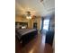 Bedroom with black furniture, striped bedding, and a ceiling fan at 6500 Colonial Dr. # 2, Myrtle Beach, SC 29572