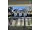 View of the townhomes with private balconies and garages, showcasing a residential community lifestyle at 6500 Colonial Dr. # 2, Myrtle Beach, SC 29572