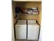 A laundry room featuring a washer, dryer, and shelf at 6500 Colonial Dr. # 2, Myrtle Beach, SC 29572