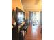 Interior view of the living room features dark cabinets and a door with lots of plants in front of it at 6500 Colonial Dr. # 2, Myrtle Beach, SC 29572