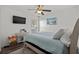 Bright bedroom with a blue bedspread, a TV, and lots of natural light at 725 Old Castle Loop, Myrtle Beach, SC 29579