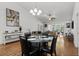 Open floor plan dining room with wood floors and views to the Gathering room at 725 Old Castle Loop, Myrtle Beach, SC 29579