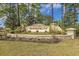 The decorative stone entrance to the Summerlyn neighborhood with manicured landscaping at 725 Old Castle Loop, Myrtle Beach, SC 29579