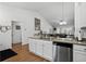 Spacious kitchen featuring granite counters, a stainless dishwasher, and hardwood floors at 725 Old Castle Loop, Myrtle Beach, SC 29579