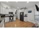 Well-lit kitchen featuring granite countertops, stainless steel appliances, and hardwood floors at 725 Old Castle Loop, Myrtle Beach, SC 29579