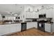 Bright kitchen with granite countertops, stainless steel appliances, and hardwood floors at 725 Old Castle Loop, Myrtle Beach, SC 29579