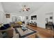 Cozy living room featuring a ceiling fan, wood floors, and a comfortable sectional sofa at 725 Old Castle Loop, Myrtle Beach, SC 29579