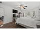 Comfortable main bedroom with wood floors, a ceiling fan, and plenty of space at 725 Old Castle Loop, Myrtle Beach, SC 29579