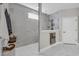 Modern bathroom with glass-enclosed shower with marble tiling and decorative niche at 7322 Sarteano Dr., Myrtle Beach, SC 29572