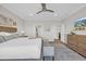 Spacious bedroom featuring soft carpet, a king bed, a ceiling fan, and neutral wall paint at 7322 Sarteano Dr., Myrtle Beach, SC 29572