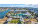 An aerial view of a large community pool with palm trees, lounge chairs, and a recreation center at 7322 Sarteano Dr., Myrtle Beach, SC 29572