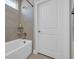 Shower and bathtub combo with decorative tile surround, corner shelves, and a rainfall shower head at 7322 Sarteano Dr., Myrtle Beach, SC 29572