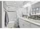 Well-lit bathroom featuring double sinks, a bathtub with shower, and stylish modern decor at 7609 Driftwood Dr., Myrtle Beach, SC 29572