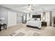 Bright bedroom featuring a neutral palette, ceiling fan, plush carpet, and a comfortable king-size bed at 7609 Driftwood Dr., Myrtle Beach, SC 29572