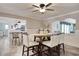 Dining room with a ceiling fan and a dining table, with barstool seating in the background at 7609 Driftwood Dr., Myrtle Beach, SC 29572