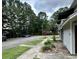 Exterior view of a street with condominiums and sidewalks, surrounded by mature trees at 801 Burcale Rd. # G-5, Myrtle Beach, SC 29579