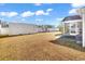 View of the backyard with a patio, screened-in porch, and a large storage container at 1032 Cadbury Ct., Conway, SC 29527