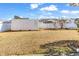 Picture of a backyard featuring a large storage container on a grassy lawn with a white fence at 1032 Cadbury Ct., Conway, SC 29527