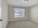 Clean bedroom with neutral walls, new carpet, and natural light at 1032 Cadbury Ct., Conway, SC 29527