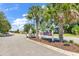 Community entrance sign framed by palm trees and landscaping in a Gathering-friendly neighborhood at 1032 Cadbury Ct., Conway, SC 29527