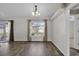 Sunny dining area with wood floors next to kitchen area with sliding doors at 1032 Cadbury Ct., Conway, SC 29527