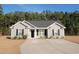 Charming single-story home with neutral siding, dark shutters, well-manicured lawn, and a long driveway to the front door at 106 Berkman Ct., Conway, SC 29527