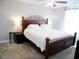 Main bedroom featuring a bed with a wooden frame, a nightstand, and carpet flooring at 106 Berkman Ct., Conway, SC 29527