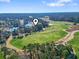 Wide aerial view of the neighborhood with a golf course and winding river through the trees at 1081 Blue Stem Dr. # 35-B, Pawleys Island, SC 29585