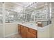 Bathroom with a double vanity and mirrored walls at 1081 Blue Stem Dr. # 35-B, Pawleys Island, SC 29585