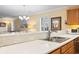 Bright kitchen with stainless steel sink and view of the living area with plantation shutters at 1081 Blue Stem Dr. # 35-B, Pawleys Island, SC 29585