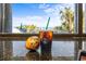 Close up of a coffee and muffin in front of a window view of the ocean and palm trees at 1105 S Ocean Blvd. # 1004, Myrtle Beach, SC 29577