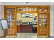 Charming coffee shop entrance with wooden framed doors and a view of the menu board and display cases at 1105 S Ocean Blvd. # 1004, Myrtle Beach, SC 29577