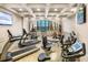 Well-equipped fitness center featuring treadmills, weight machines, and a large window with views of the surrounding area at 1105 S Ocean Blvd. # 1004, Myrtle Beach, SC 29577