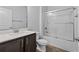 Bathroom with white countertop vanity, a mirror, and a glass-enclosed shower at 1108 Inlet View Dr., North Myrtle Beach, SC 29582