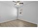 Bedroom featuring a ceiling fan, light colored wood flooring, and a window at 1108 Inlet View Dr., North Myrtle Beach, SC 29582