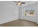 Bedroom featuring a ceiling fan, light colored wood flooring, and a window at 1108 Inlet View Dr., North Myrtle Beach, SC 29582