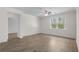 Cozy bedroom with wood-look tile flooring, a ceiling fan, and plenty of natural light at 1108 Inlet View Dr., North Myrtle Beach, SC 29582