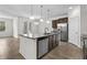 Spacious kitchen with granite island, stainless steel appliances, and wood-look tile flooring at 1108 Inlet View Dr., North Myrtle Beach, SC 29582